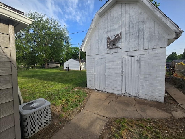 117 E Buford St, Wellington, MO 64097 - view of outdoor structure featuring central AC and an outbuilding
