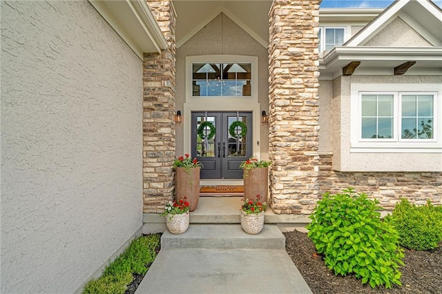 2705 NE Crestview St, Blue Springs, MO 64029 - doorway to property featuring stucco siding, stone siding, and french doors