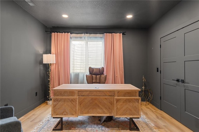 2705 NE Crestview St, Blue Springs, MO 64029 - office featuring light wood-style flooring, a textured ceiling, recessed lighting, and baseboards