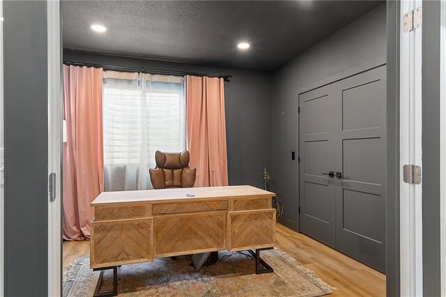 2705 NE Crestview St, Blue Springs, MO 64029 - home office featuring light wood-style flooring, recessed lighting, and a textured ceiling