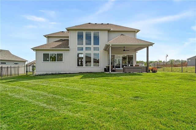 2705 NE Crestview St, Blue Springs, MO 64029 - rear view of house with ceiling fan, roof with shingles, and outdoor lounge area