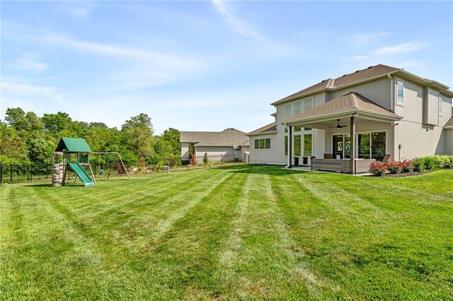 2705 NE Crestview St, Blue Springs, MO 64029 - view of yard featuring a ceiling fan, a patio, a playground, and an outdoor hangout area