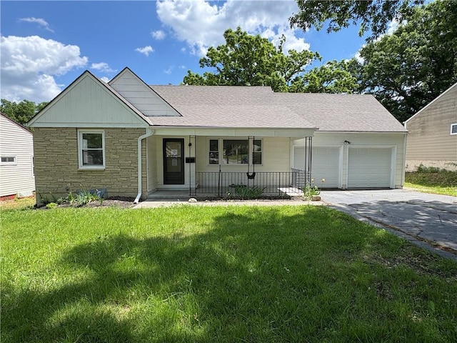 7115 Myrtle Ave, Kansas City, MO 64132 - single story home with stone siding, a porch, asphalt driveway, and a front lawn