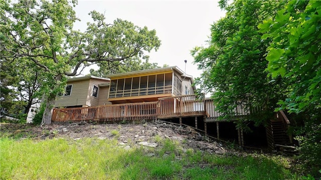 25996 Arrowhead Rd, Hermitage, MO 65668 - rear view of house with a sunroom and a wooden deck