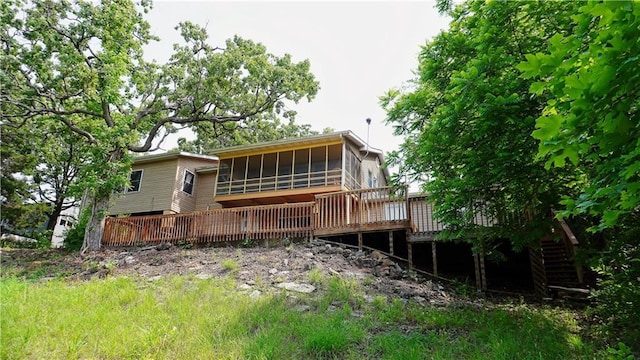 25996 Arrowhead Rd, Hermitage, MO 65668 - rear view of house with a sunroom and a deck