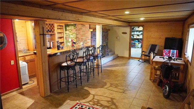 25996 Arrowhead Rd, Hermitage, MO 65668 - indoor dry bar with recessed lighting, light tile patterned floors, and wood walls