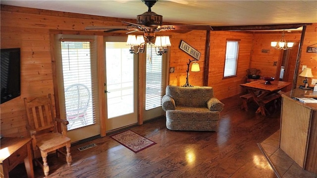25996 Arrowhead Rd, Hermitage, MO 65668 - sitting room with wood walls, a chandelier, wood finished floors, and a ceiling fan
