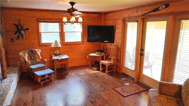 25996 Arrowhead Rd, Hermitage, MO 65668 - living area featuring ceiling fan, wood finished floors, and wooden walls