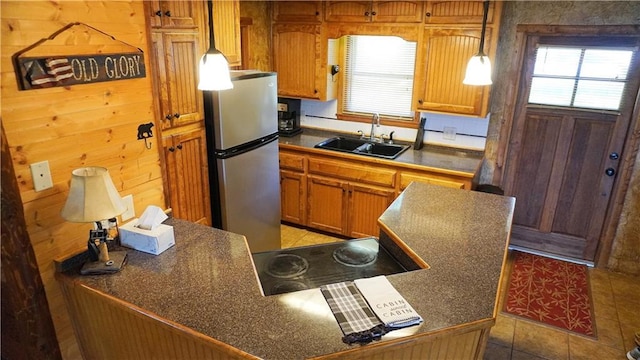 25996 Arrowhead Rd, Hermitage, MO 65668 - kitchen featuring freestanding refrigerator, a sink, light tile patterned floors, and pendant lighting