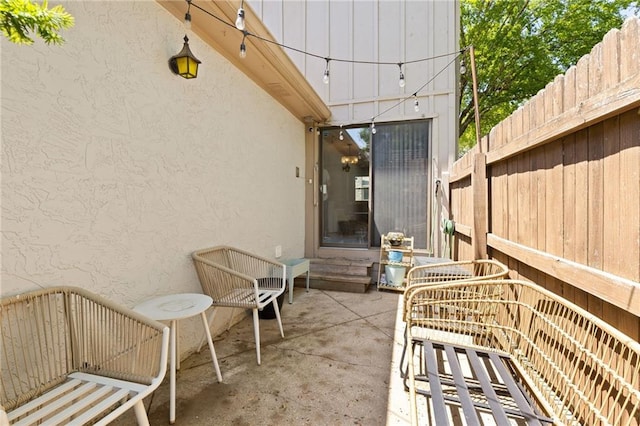 view of patio / terrace featuring fence
