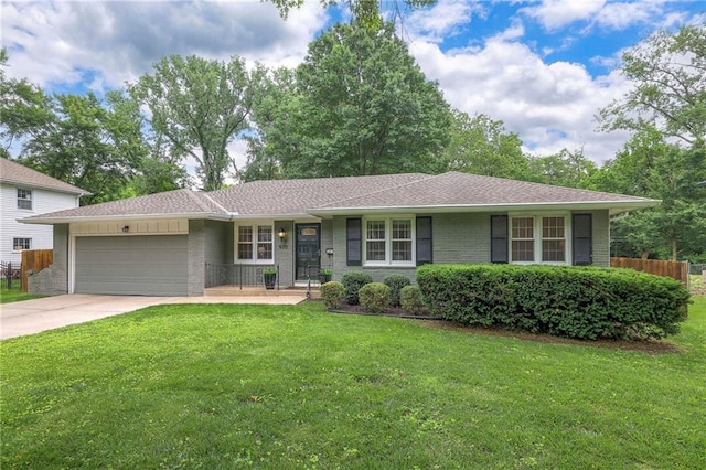 9711 Roe Ave, Overland Park, KS 66207 - ranch-style house featuring an attached garage, brick siding, and concrete driveway