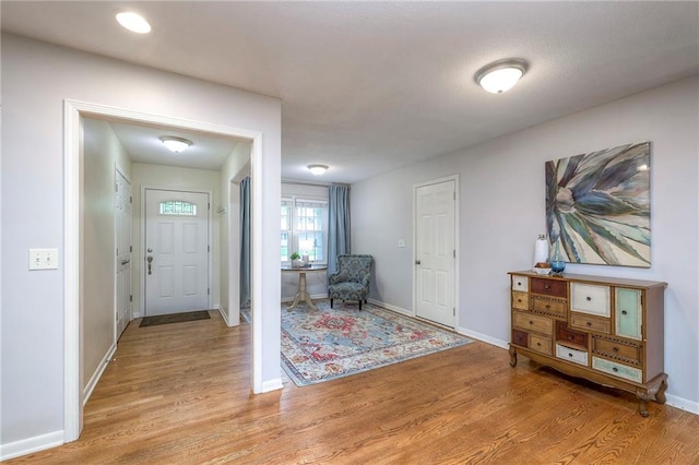 9711 Roe Ave, Overland Park, KS 66207 - foyer with light wood-style flooring and baseboards