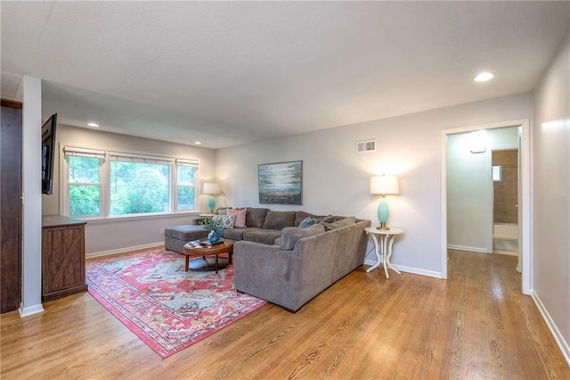 9711 Roe Ave, Overland Park, KS 66207 - living area featuring light wood-type flooring and recessed lighting