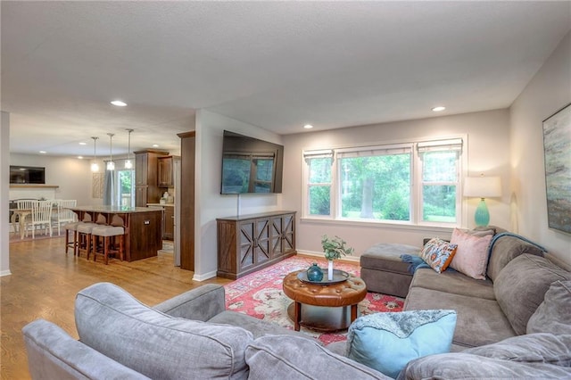 9711 Roe Ave, Overland Park, KS 66207 - living area with healthy amount of natural light, light wood-type flooring, and recessed lighting