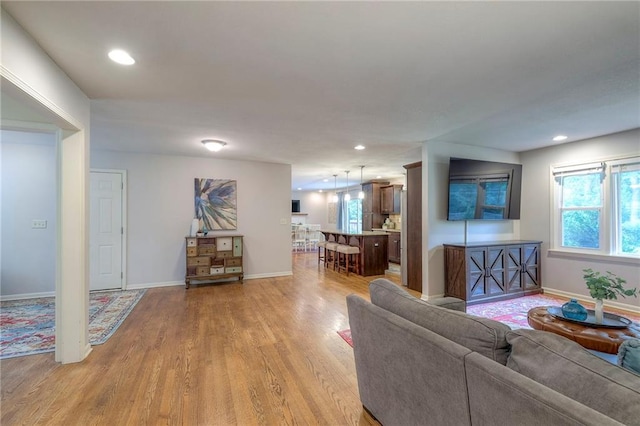 9711 Roe Ave, Overland Park, KS 66207 - living area featuring light wood finished floors and recessed lighting