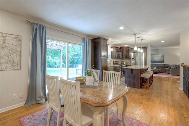 9711 Roe Ave, Overland Park, KS 66207 - dining space featuring light wood finished floors and recessed lighting