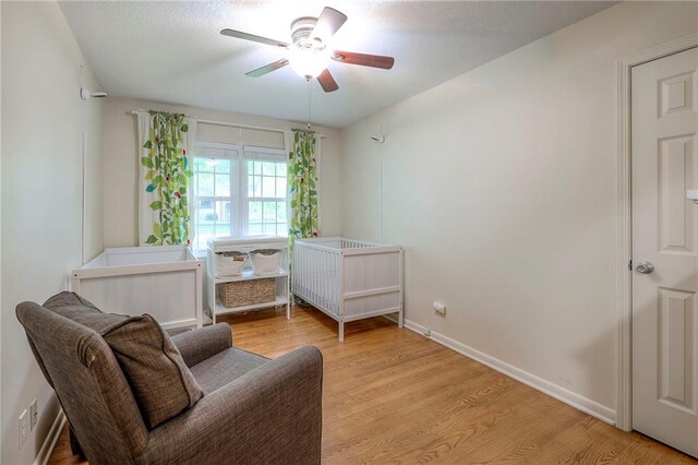 9711 Roe Ave, Overland Park, KS 66207 - bedroom with light wood-type flooring and a ceiling fan