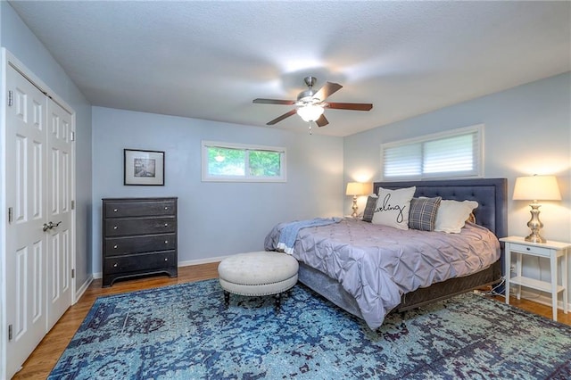 9711 Roe Ave, Overland Park, KS 66207 - bedroom featuring wood finished floors, ceiling fan, and a closet