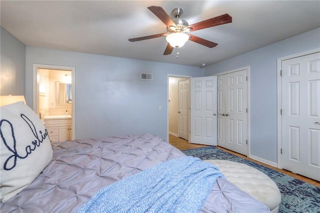 9711 Roe Ave, Overland Park, KS 66207 - bedroom with light wood-style flooring, ensuite bathroom, and a ceiling fan