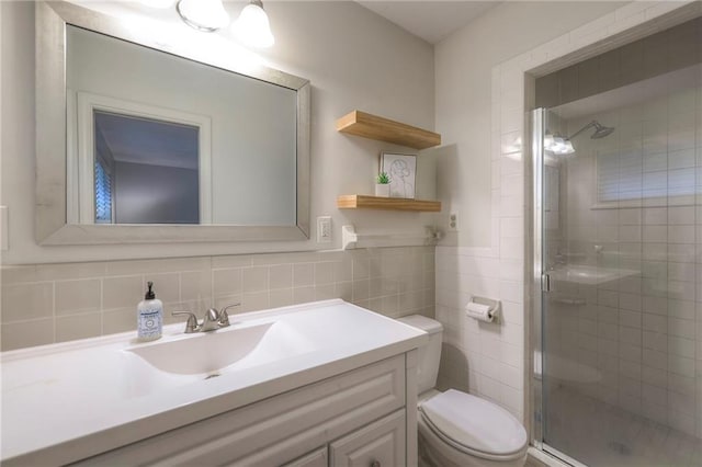9711 Roe Ave, Overland Park, KS 66207 - full bath featuring vanity, a stall shower, and tile walls