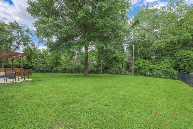 9711 Roe Ave, Overland Park, KS 66207 - fenced backyard with a pergola and a patio