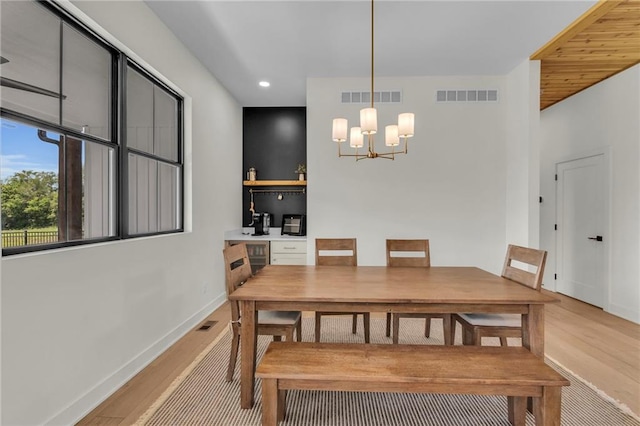 21851 179th St, Tonganoxie, KS 66086 - dining room with light wood-type flooring, a chandelier, and recessed lighting