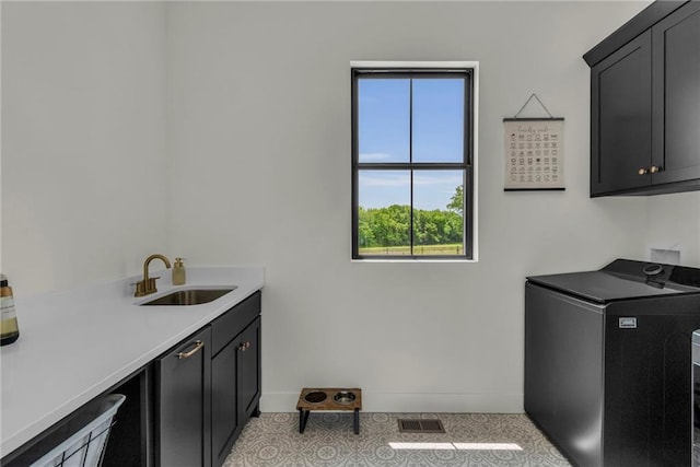 21851 179th St, Tonganoxie, KS 66086 - laundry room with cabinet space and baseboards