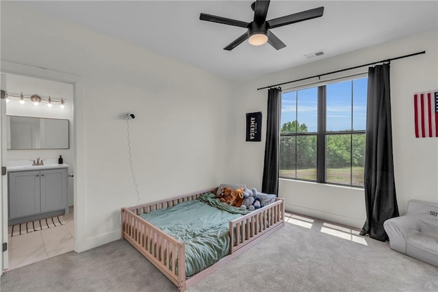 21851 179th St, Tonganoxie, KS 66086 - bedroom with ensuite bathroom, light colored carpet, and a ceiling fan