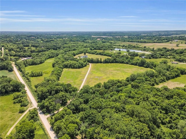 21851 179th St, Tonganoxie, KS 66086 - aerial view of a heavily wooded area and a nearby body of water