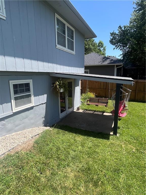 1424 S Olive St, Ottawa, KS 66067 - rear view of house with a patio