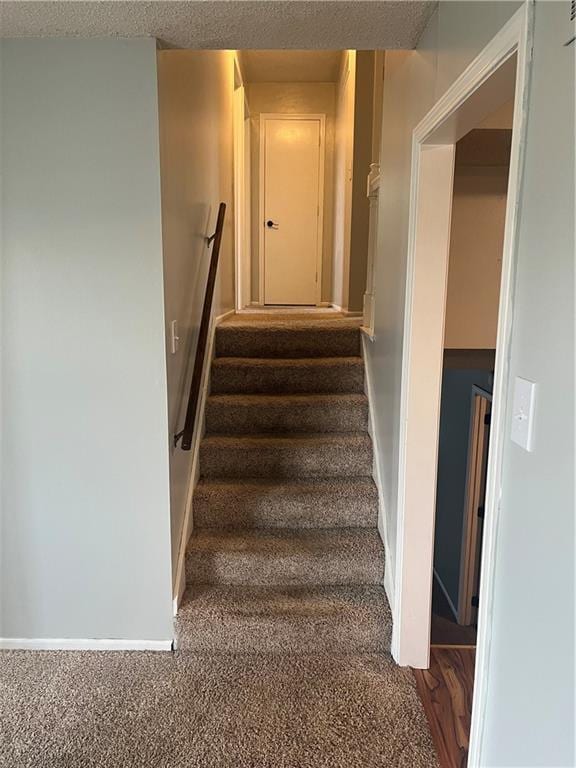 1424 S Olive St, Ottawa, KS 66067 - stairs featuring baseboards and carpet