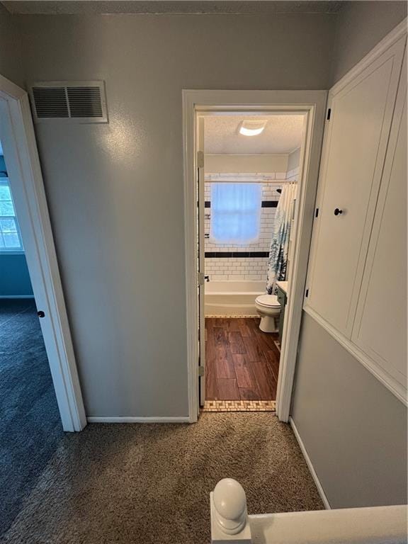 1424 S Olive St, Ottawa, KS 66067 - hallway with carpet flooring and baseboards