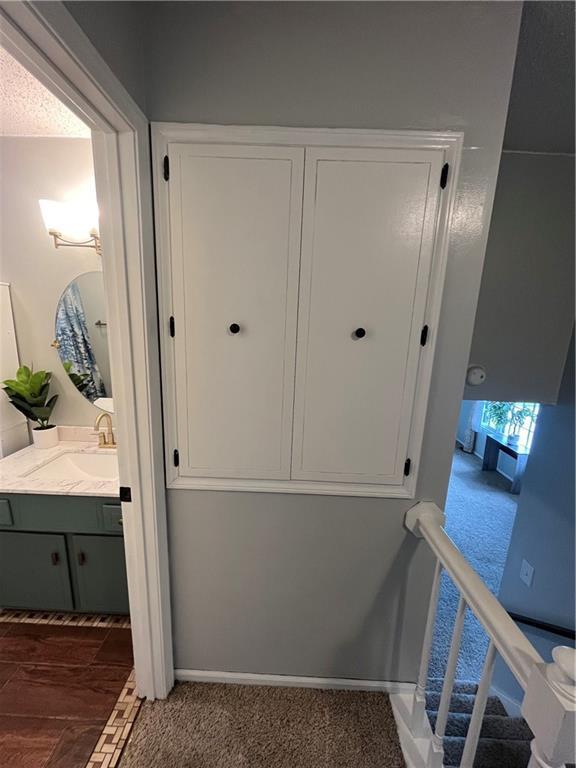 1424 S Olive St, Ottawa, KS 66067 - corridor featuring a sink