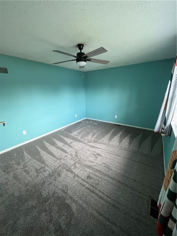 1424 S Olive St, Ottawa, KS 66067 - spare room with a ceiling fan, a textured ceiling, and carpet