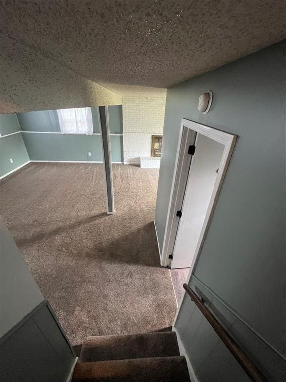 1424 S Olive St, Ottawa, KS 66067 - stairway with carpet and a textured ceiling