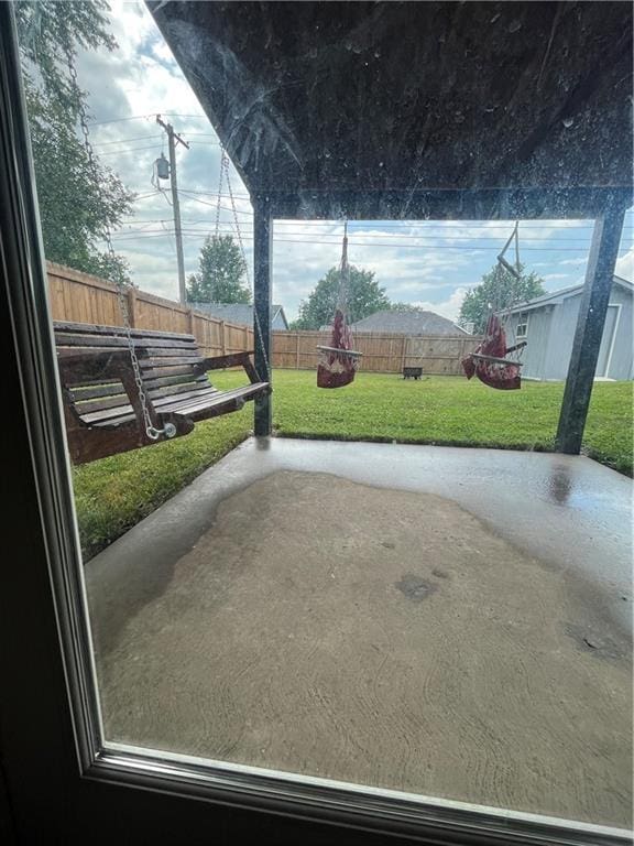 1424 S Olive St, Ottawa, KS 66067 - fenced backyard featuring a patio area