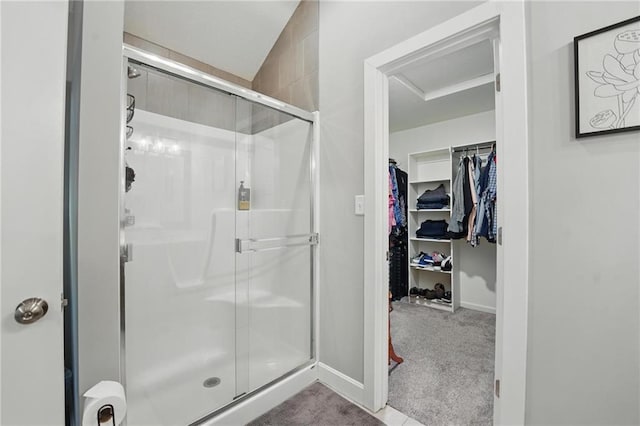 19553 E 14th St N, Independence, MO 64056 - full bathroom with a stall shower, a walk in closet, and baseboards