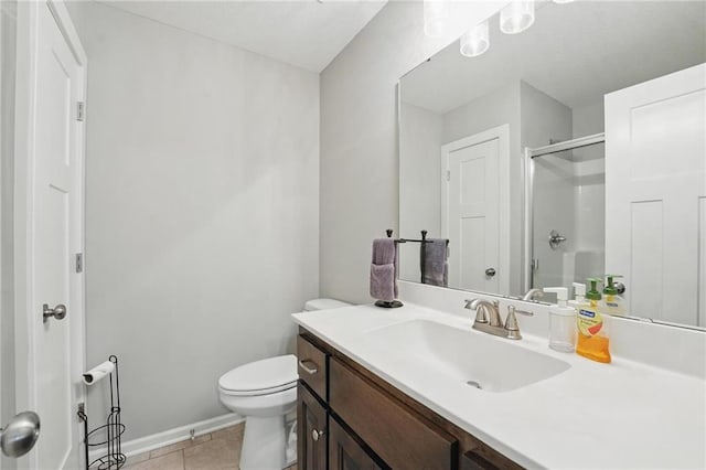 19553 E 14th St N, Independence, MO 64056 - full bathroom with vanity, a shower stall, tile patterned floors, toilet, and baseboards