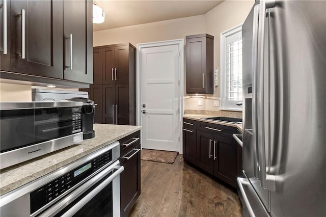 14160 Juniper St, Leawood, KS 66224 - kitchen with stainless steel appliances, dark wood finished floors, dark brown cabinets, and light stone countertops