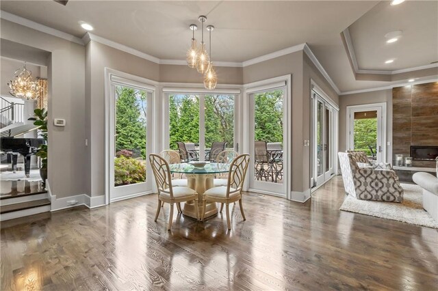 14160 Juniper St, Leawood, KS 66224 - dining room featuring a chandelier, wood finished floors, baseboards, recessed lighting, and crown molding
