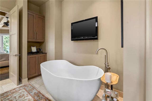 14160 Juniper St, Leawood, KS 66224 - full bath with a freestanding tub, a ceiling fan, ensuite bath, and baseboards