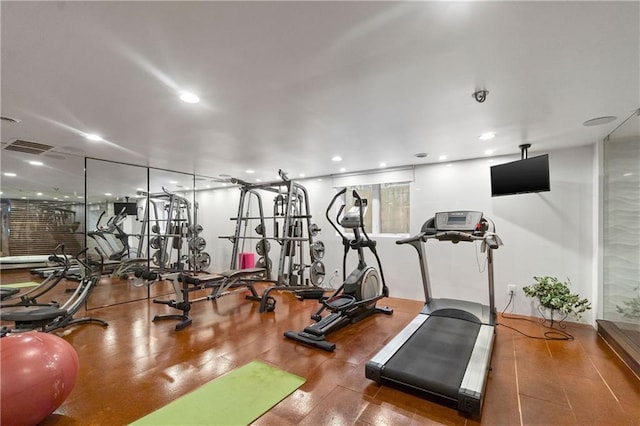 14160 Juniper St, Leawood, KS 66224 - exercise room featuring wood finished floors and recessed lighting