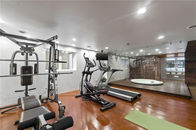 14160 Juniper St, Leawood, KS 66224 - gym featuring plenty of natural light, wood finished floors, and recessed lighting