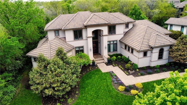 14160 Juniper St, Leawood, KS 66224 - view of front of house with stucco siding, a tile roof, and a front lawn