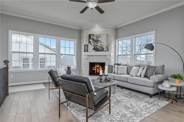 21746 W 120th Ct Unit 3303, Olathe, KS 66061 - living area featuring plenty of natural light, a ceiling fan, wood finished floors, ornamental molding, and a fireplace