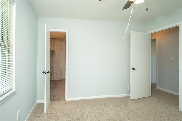 3668 Colorado Rd, Pomona, KS 66076 - unfurnished bedroom featuring light carpet, baseboards, and ceiling fan
