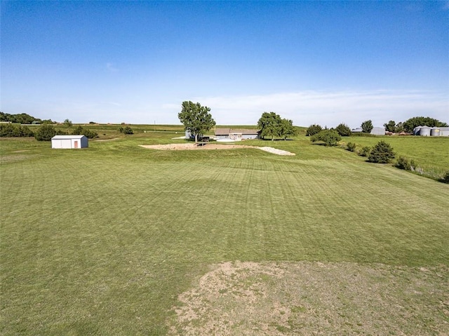 3668 Colorado Rd, Pomona, KS 66076 - view of green lawn with a storage unit and an outbuilding