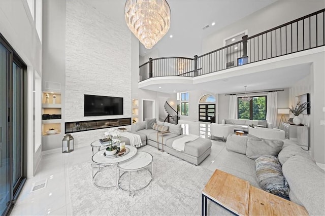 5645 Legler St, Shawnee, KS 66217 - tiled living room featuring a towering ceiling, stairs, a chandelier, and recessed lighting