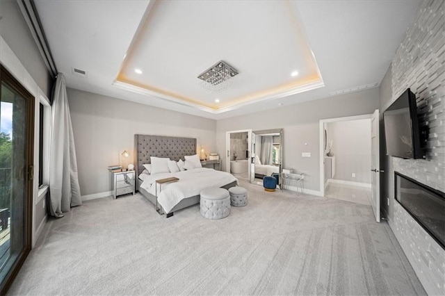 5645 Legler St, Shawnee, KS 66217 - carpeted bedroom with a fireplace, a tray ceiling, and recessed lighting
