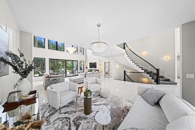 5645 Legler St, Shawnee, KS 66217 - living area with a chandelier, a towering ceiling, and stairs